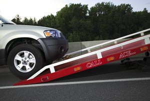 SUV Being Loaded on Tow Truck