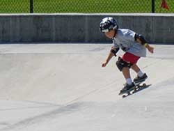 child on a skate board in the Santa Clara skate park