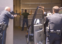 Officers with weapons drawn