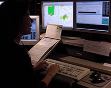 image of dispatch personnel handling a call at Communications center