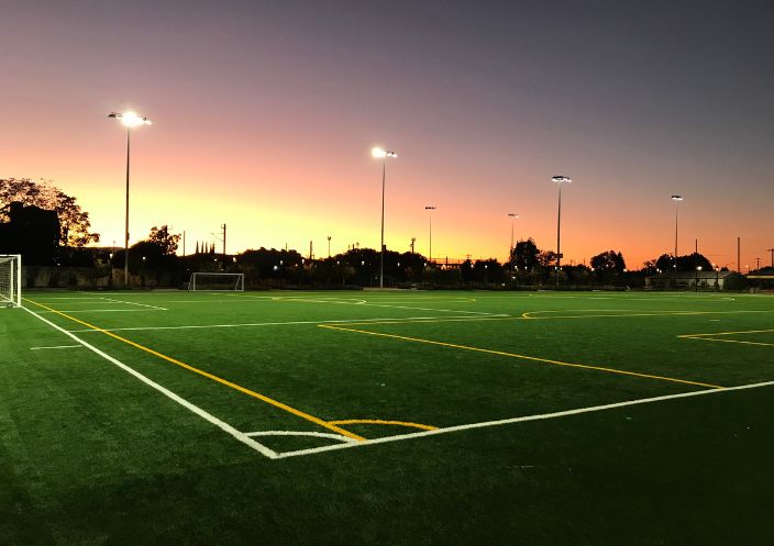 Reed and Grant sports field at sunset